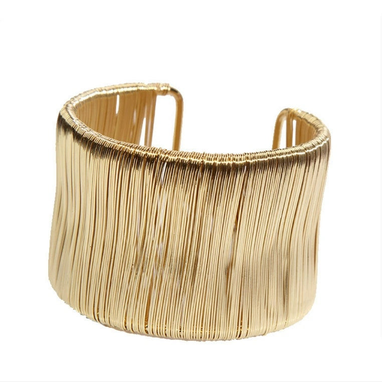 Handcrafted Gold-plated Geometric Cuff Bracelets And Boho-chic Metal Tassel Arm Rings With Vintage-inspired Exaggerated Water Drop Designs, Offering Unisex Luxury Accessories In Open Bangle Styles