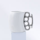 White cup with silver handle